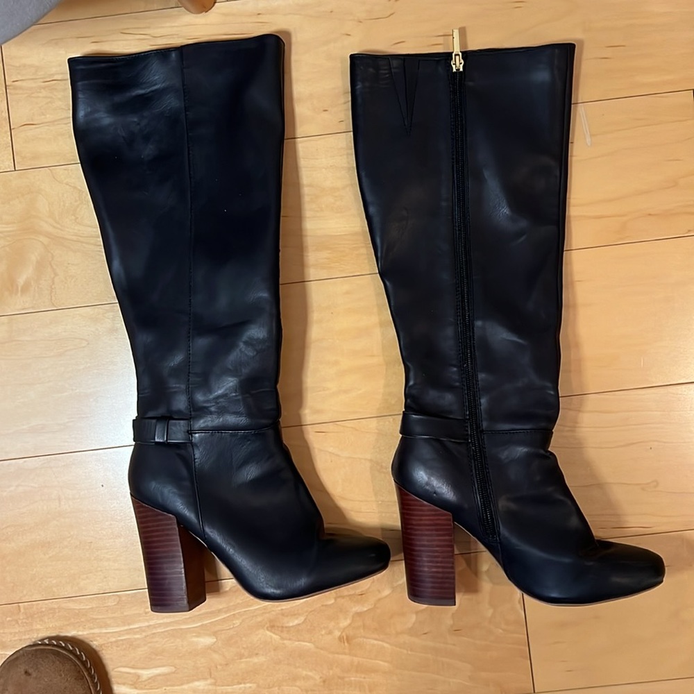 Black faux leather knee high boots with faux wooden heal